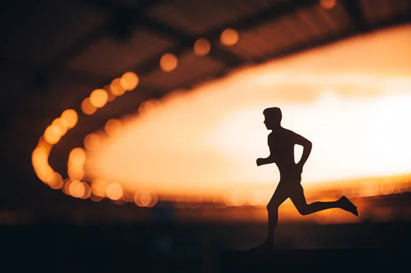 Silhouette Male Athlete Endurance Runner Emerges Strong Blurred Background Modern — Stock Photo, Image