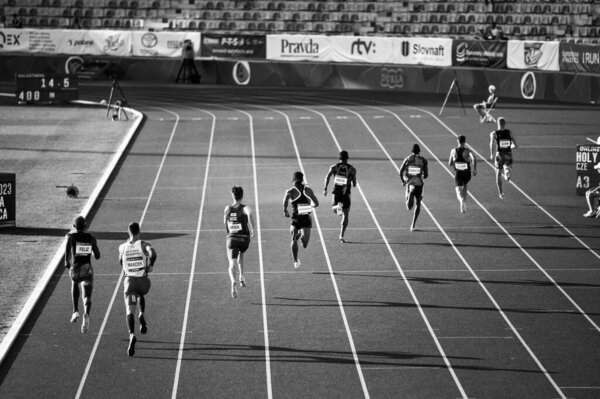 B. BYSTRICA, SLOVAKIA, JULY 20, 2023: Black and Wgite Track and Field photo. Men Sprint race