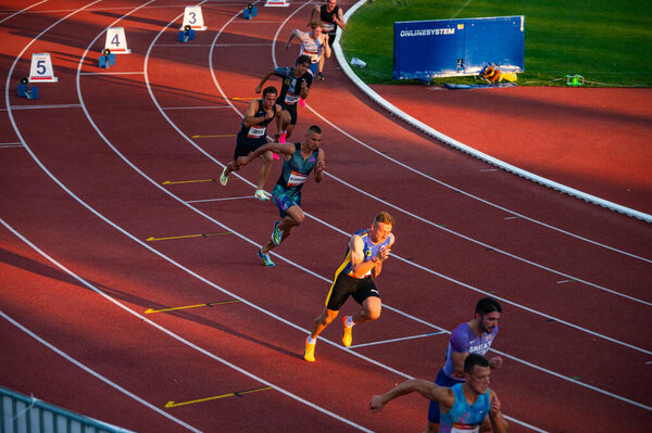 B. BYSTRICA, SLOVAKIA, JULY 20, 2023: Male Sprinters in Action: Competing during the 200m Race at Track and Field Event for Worlds in Budapest and Summer olympic Games in Paris