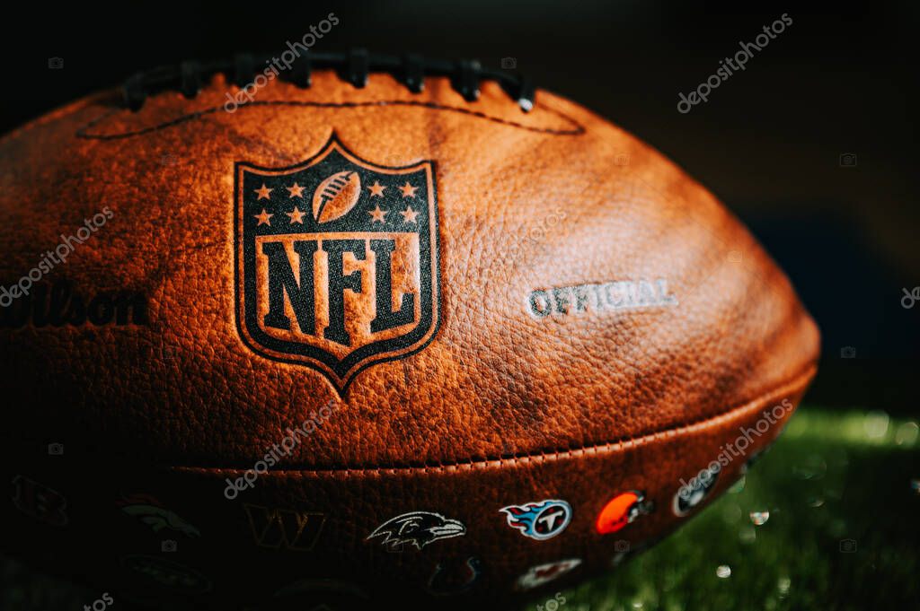 NEW YORK, USA, SEPTEMBER 11, 2023: NFL Leather Ball and Emblem in Focus. National Football League official ball