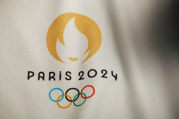 PARIS, FRANCE, JANUARY 4. 2024: White Backdrop Showcasing the Official Logo of the Paris 2024 Summer Olympics