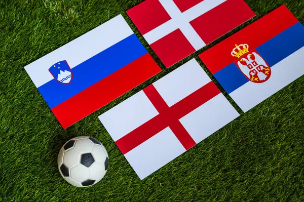 stock image Football Tournament in Germany 2024: Group C and national flags of Slovenia, Denmark, Serbia, England and soccer ball on green grass
