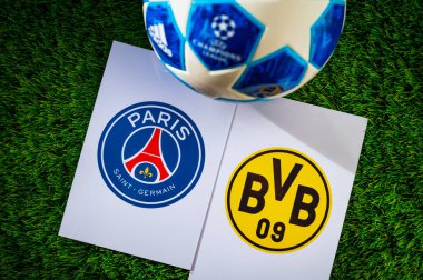 PARIS, FRANCE, APRIL 28. 2024: Paris Saint-Germain (FRA) vs Borussia Dortmund (GER). Semifinals of football UEFA Champions League 2024 in Europe. Logo of teams and official soccer ball on green grass clipart