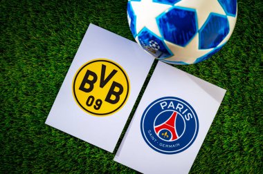 DORTMUND, GERMANY, APRIL 28. 2024: Borussia Dortmund (GER) vs Paris Saint-Germain (FRA). Semifinals of football UEFA Champions League 2024 in Europe. Logo of teams and official soccer ball on green gras clipart