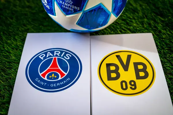 stock image PARIS, FRANCE, APRIL 28. 2024: Paris Saint-Germain (FRA) vs Borussia Dortmund (GER). Semifinals of football UEFA Champions League 2024 in Europe. Logo of teams and official soccer ball on green grass