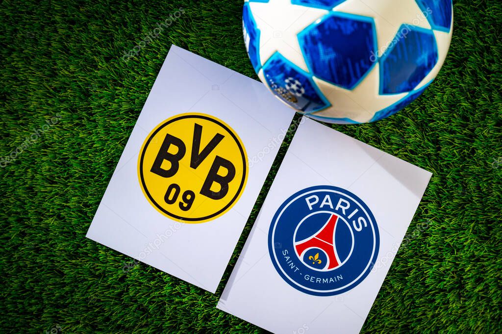 DORTMUND, GERMANY, APRIL 28. 2024: Borussia Dortmund (GER) vs Paris Saint-Germain (FRA). Semifinals of football UEFA Champions League 2024 in Europe. Logo of teams and official soccer ball on green gras