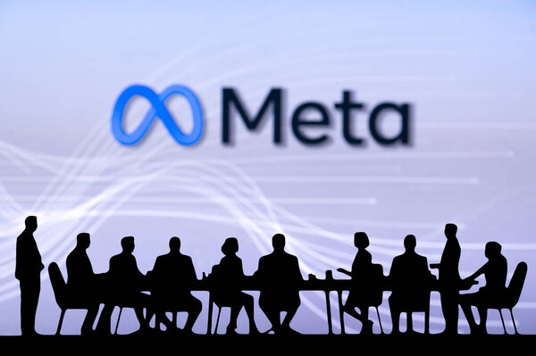 CALIFORNIA, USA, OCTOBER 10, 2024: Meta Company Bussiness meeting. Silhouette of business people sitting behind the table and discussing.