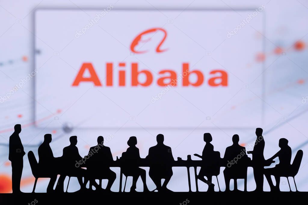 HANGZHOU, CHINA, OCTOBER 10, 2024: Alibaba Company Bussiness meeting. Silhouettes of executives in a conference room, analyzing charts and discussing future growth.