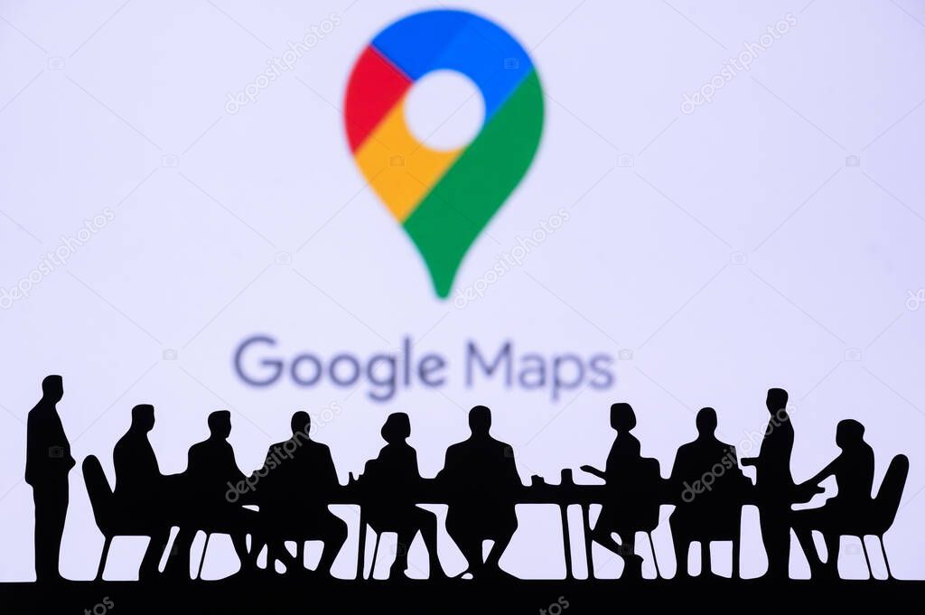 MOUNTAIN VIEW, USA, OCTOBER 10, 2024: Google Maps CEO Business and Visionary Meeting. Key decision-makers gathered in a sleek conference room, discussing market expansion, with a company logo.