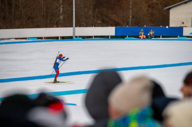 Biathlon Stock photo. Female biathlon athlete on horizon while winter training clipart