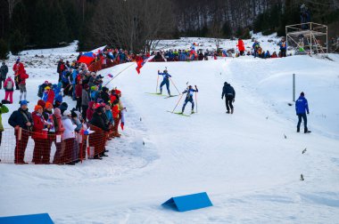 OSRBLIE, SLOVAKIA, JANUARY 24, 2024: Biathlon female race. Crowd supporting athletes doing winter olympics sport. clipart