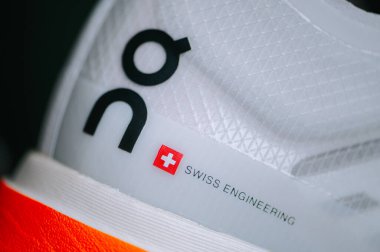 BERN, SWITZERLAND, DECEMBER 19. 2024: On Running shoes. Swiss engineering writen on Cloudboom Strike Shoes clipart