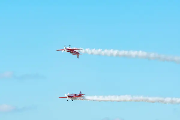 stock image Leszno, Poland - June, 22, 2024: Antidotum Airshow Leszno, Zelazny Aerobatic Team, Zlin 50. Pilots perform acrobatics in the sky, they leave spectacular smoke behind the plane.