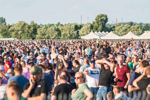 stock image Leszno, Poland - June, 22, 2024: Antidotum Airshow Leszno. A large audience gathered at the airport on the second day of the air show, all admiring the acrobatics of planes in the sky.