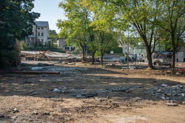 Ladek Zdroj, Poland - September, 17, 2024: Mud and garbage carried by the water, major destruction, two days after the flood wave passed through the city. View from Maria Sklodowska Curie Square clipart