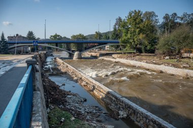 Ladek Zdroj, Poland - September, 17, 2024: Biala Ladecka riverbed, flooded houses and destroyed river bank, two days after the flood wave passed through the city. View from Kosciuszki Street. clipart