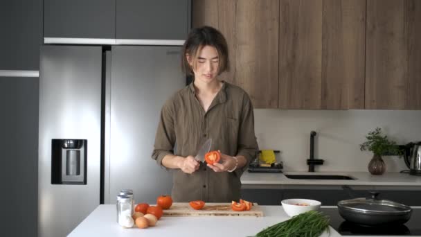 Smiling Asian Young Man Cutting Tomatoes Kitchen — Stock Video