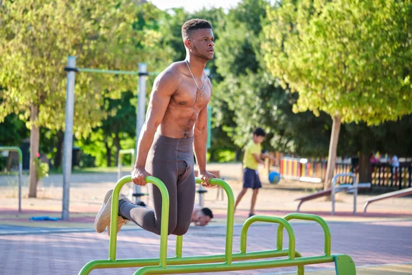 Young Fit Shirtless Black Man Doing Calisthenics Workout Parallel Bars — Stockfoto