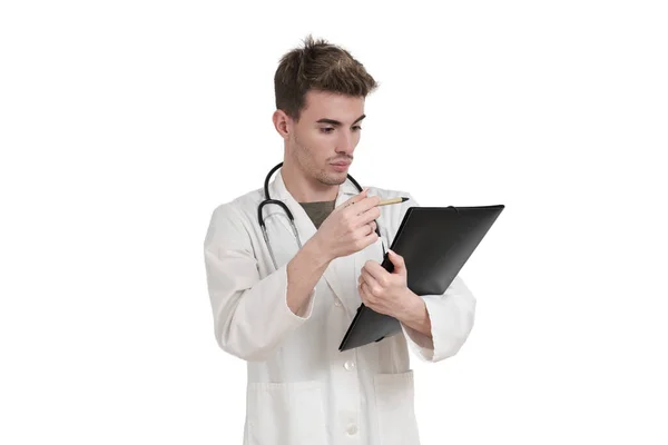 Young Caucasian Male Doctor Reading Medical Report Isolated White Background — Stock Photo, Image