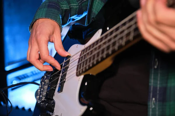 stock image Unrecognizable musician man playing electric bass. Music production.