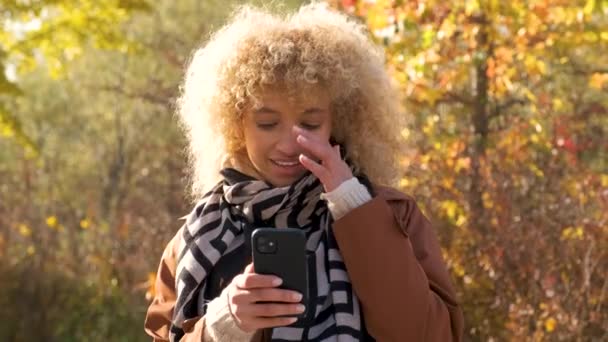 Young Brazilian Woman Using Smartphone Smiling Looking Camera Park Autumn — Stock Video