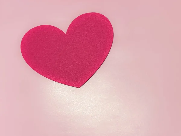 The theme of the holiday of Valentine\'s Day, Valentine\'s Day. Hearts on a pink background.