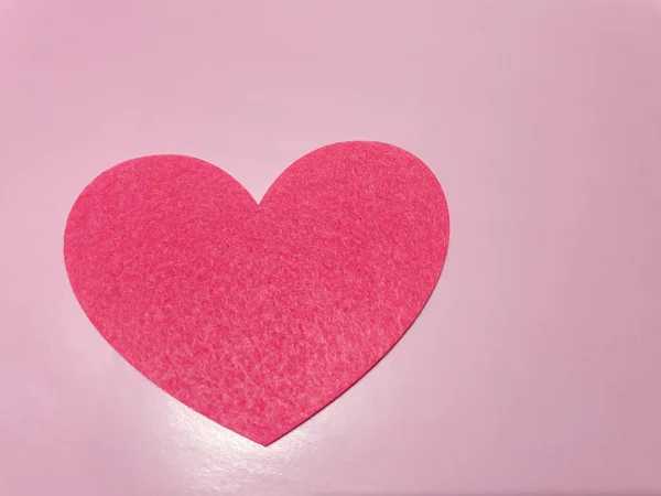 The theme of the holiday of Valentine's Day, Valentine's Day. Hearts on a pink background.