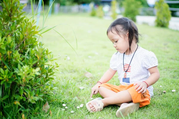 Cute Asian Little Girl Sits Grass Park — Stock Photo, Image
