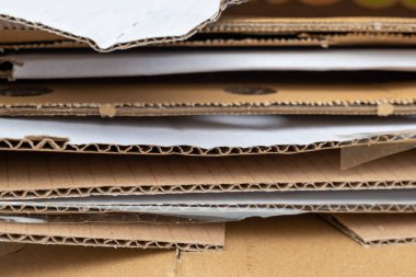 paper waste stacked on top of each other in selective focus