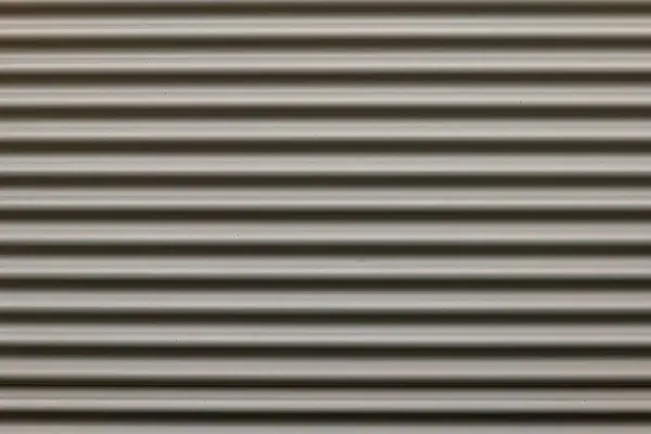 a gray corrugated iron wall in the city in germany