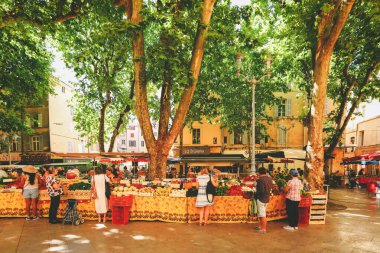 Aix-en-Provence, France - May 09, 2017 : The food market on the square in Aix-en-Provence. clipart