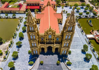 AERIAL VIEW OF XUONG DIEN CHURCH BY THE SEA. Xuong Dien Church is a very beautiful church built by the sea in Hai Hau district, Namdinh province, Vietnam. Interior furniture are plated with real gold.  clipart