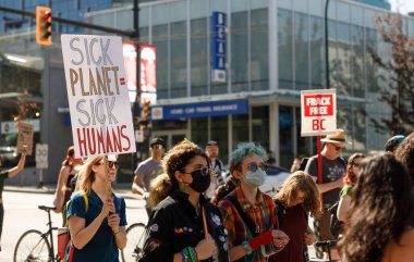 Vancouver, Canada - September 15,2023; View of sign Sick Planet Sick Humans as part of Global Climate Strike in front of Vancouver City Hall clipart