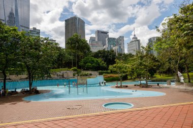 Luala Lumpur, Malaysia - January 3,2023: Huge waterpark nestled inside the beautiful KLCC Park, located in the heart of Kuala Lumpur city clipart