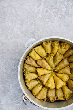 Green grape leaves stuffed with rice and herbs in Turkish cuisine.
