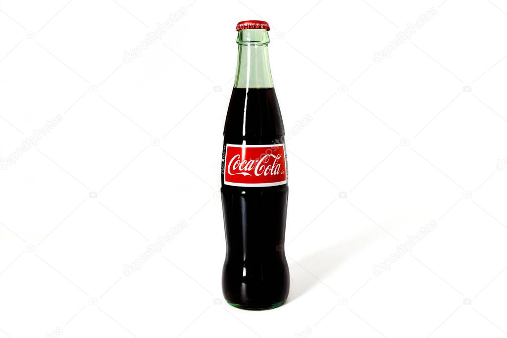 February 4, 2023. Spartanburg, SC USA. Glass bottle of Classic Coca-Cola on white background.