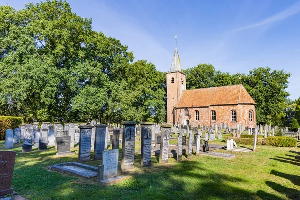 stock image Marum, The Netherlands - September 2, 2022: Church with graveyard in Marum in municipality Westerkwartier in Groningen province the Netherlands