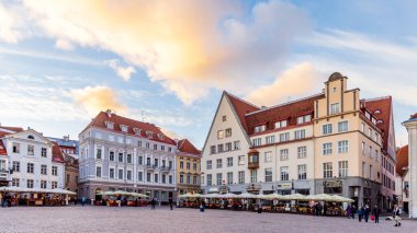 Tallinn, Estonia - October 19, 2022: Cityscape with restaurants at town hall market square in the center of old medieval town of Tallinn in Estonia Unesco world heritage site