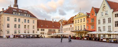 Tallinn, Estonia - October 19, 2022: Cityscape with restaurants at town hall market square in the center of old medieval town of Tallinn in Estonia Unesco world heritage site