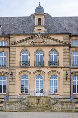 Echternach, Luxembourg - Januari 1, 2023: Cityscape of Echternach entrance to Abbey of Willibrordus area directly from parking in oldest town in Luxembourg. Near Mullerthal.