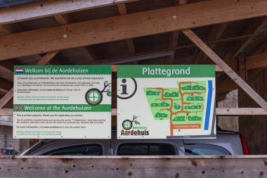 Olst Wijhe, The Netherlands - January 21, 2023: Information panel at Self-build earth houses sustainable circular and nature inclusive neighbourhood in Olst Wijhe in Overijssel The Netherlands