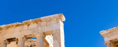 Ancient column at Acropolis site on a sunny evening in Athens Greece