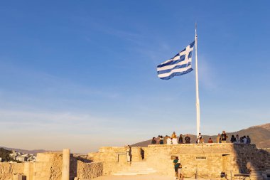 Athens, Greece: September 24, 2021: Greek flag in the evening suns at Acropolis site in Athens in Greece