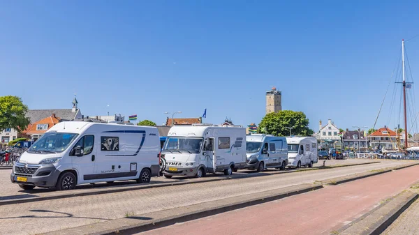 stock image Terschelling, The Netherlands - June 10, 2023: Campers in line for the ferry to Harlingen at West-Terschelling in Friesland province in The Netherlands