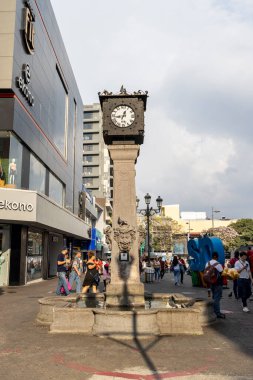 San Jose, Costa Rica -March 26, 2024: Cityscape with publick clock tower and fountain at avenida central square in the center of San Jose capital city of Costa Rica clipart