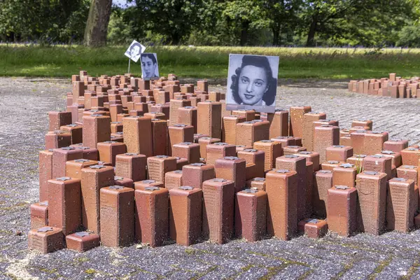 stock image Westerbork, The Netherlands - June 15, 2024: Red bricks in memory of the murder of the poeple in National monument World War Two transit Camp Westerbork in Drenthe Province in The netherlands.