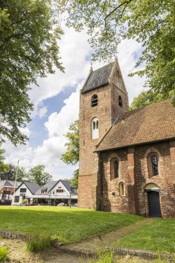 Norg, The Netherlands - July 7, 2024: Monumental ancient churg in the center og village Norg in Municipality Noordenveld in the Netherlands. Traditional Esdorp in Northern Drenthe. clipart