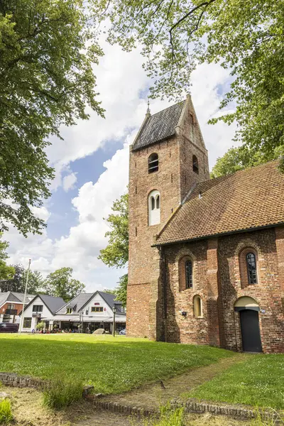 stock image Norg, The Netherlands - July 7, 2024: Monumental ancient churg in the center og village Norg in Municipality Noordenveld in the Netherlands. Traditional Esdorp in Northern Drenthe.