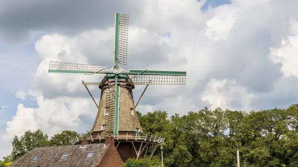 stock image Floor windmill in the center of village Norg in Municipality Noordenveld in the Netherlands. Traditional Esdorp in Northern Drenthe.