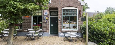 Orvelte, The Netherlands - July 9, 2024: Historic food store in Orvelte picturesque monumental little town in Drenthe in The Netherlands. clipart